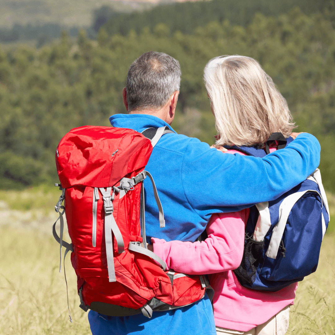 Active mature couple hiking together outdoors