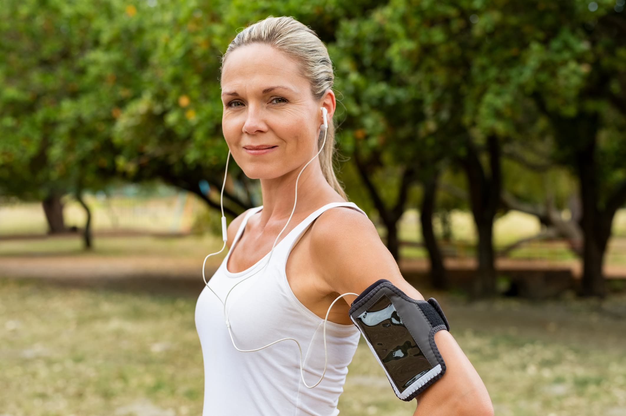 Active woman exercising outdoors after a medical weight loss program